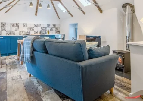 9 Chapel Street, Mousehole is a beautifully renovated cottage in this idyllic fishing village, featuring original beams, a cosy wood burner, reverse-level living, and a sumptuous bathroom, just moments from the harbour and coastal paths.