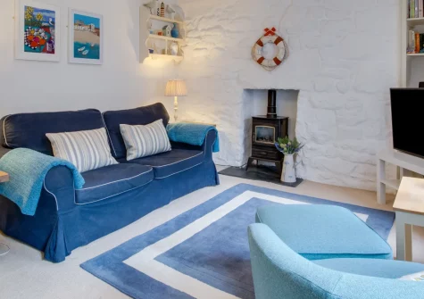 9 Teetotal Street, St Ives is a lovingly restored fisherman's cottage in the historic quarter, featuring exposed stone walls, country-style interiors, and stable door entrance, with three sandy beaches and the harbour just metres from your door.