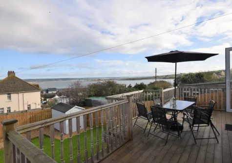 The decked balcony & alfresco dining area at A Rare Old Station, Appledore