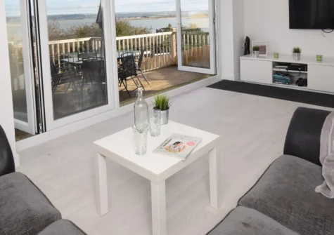 A Rare Old Station, Appledore is a spacious four-bedroom cottage with a decked balcony boasting glorious estuary views, strolling distance to the village's quayside pubs, galleries and the South West Coast Path, perfect for family holidays.