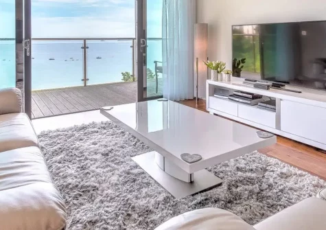 Abalone, St Ives is a stunning two-bedroom seafront apartment offering breathtaking panoramic ocean views over Porthminster Beach. Enjoy stylish contemporary interiors, modern amenities, and a private seaward balcony perfect for relaxation.
