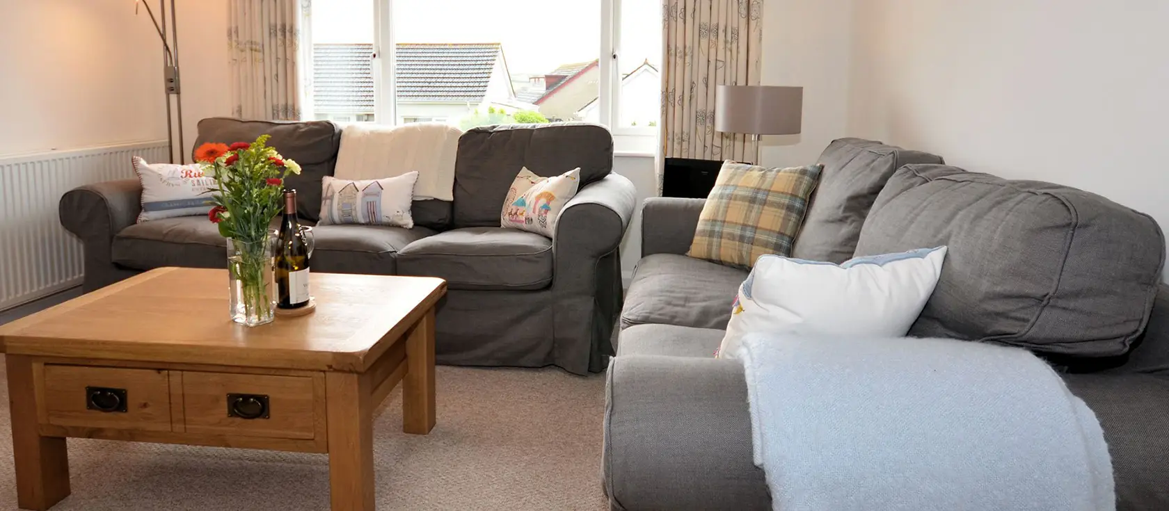 Aglets Cottage, Bude is a bright, detached bungalow offering sea glimpses, a wraparound enclosed garden, & comfortable accommodation for four guests. A short stroll from Bude's amenities and beaches, it's perfect for families seeking a coastal break.