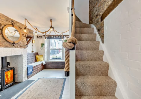 The living / dining area & stairs up to the first floor at Albatross Cottage, Looe