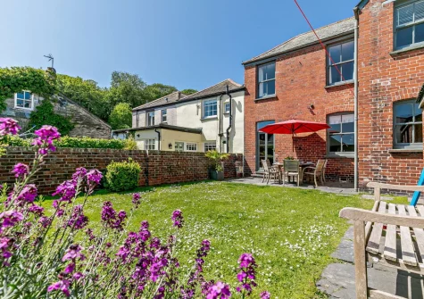 The patio, alfresco dining area, enclosed garden & outdoor sitting area at Alexandra House, Padstow
