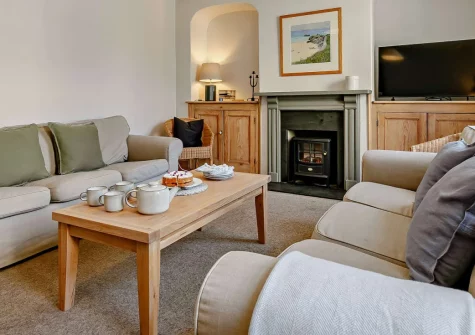 Alexandra House, Padstow is a welcoming four-bedroom property in the heart of Padstow's conservation area, featuring a sun-drenched garden with barbecue, cosy wood burner-effect stove, and easy access to the estuary beaches and harbour.