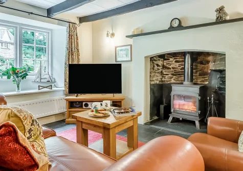 Alice's Cottage, Looe is a characterful stone cottage with exposed wooden beams and slate floors. Enjoy peaceful woodland surroundings, spacious patio for outdoor dining, and convenient access to Cornwall's stunning coastline and villages.