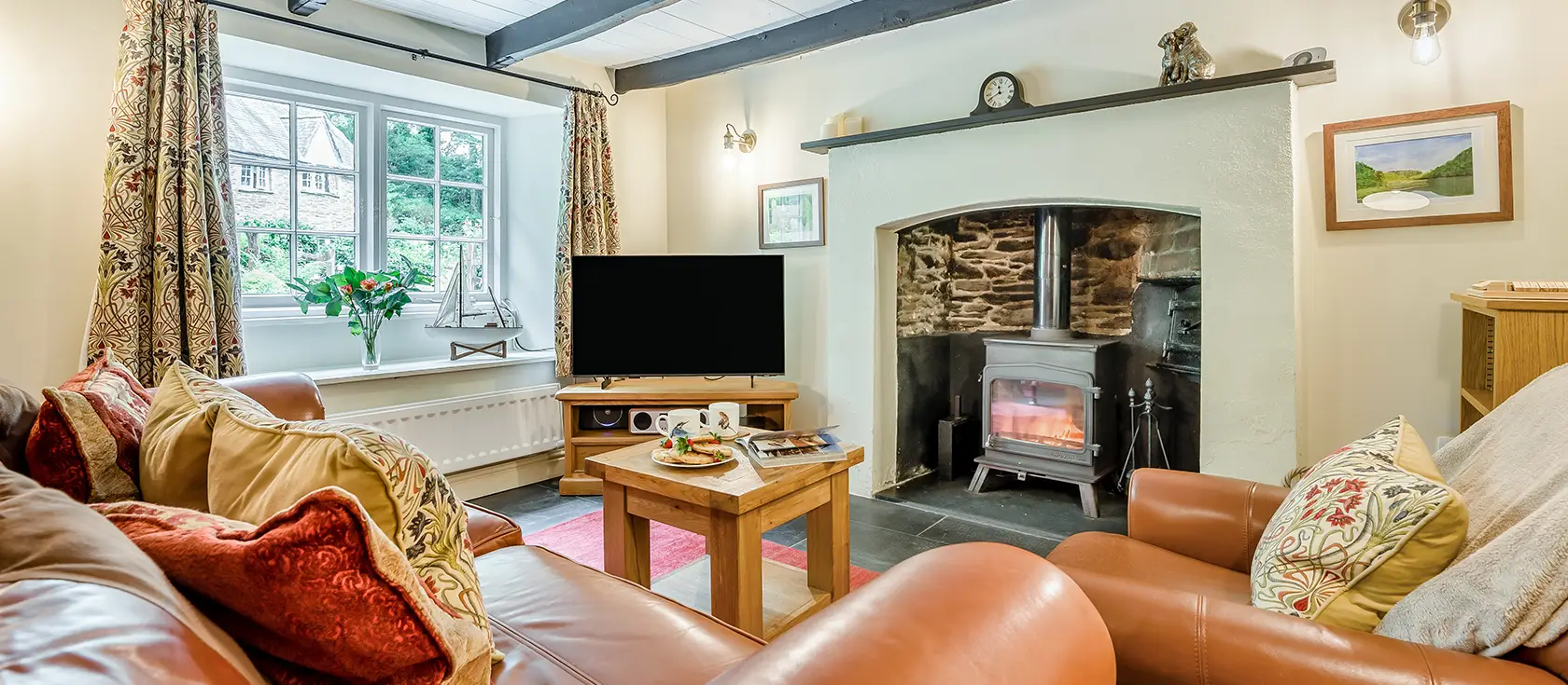 Alice's Cottage, Looe is a characterful stone cottage with exposed wooden beams and slate floors. Enjoy peaceful woodland surroundings, spacious patio for outdoor dining, and convenient access to Cornwall's stunning coastline and villages.