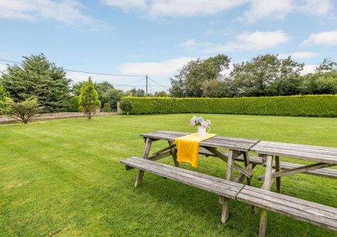 The lawned garden & alfresco dining area at Alminstone House, Woolsery