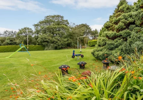 The extensive lawned garden & children's play area at Alminstone House, Woolsery