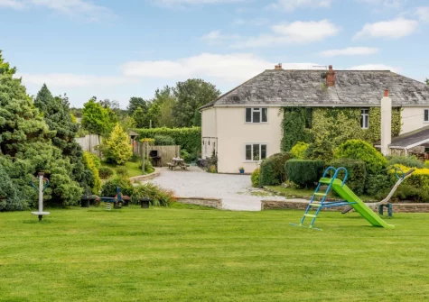 The extensive lawned garden & children's play area at Alminstone House, Woolsery