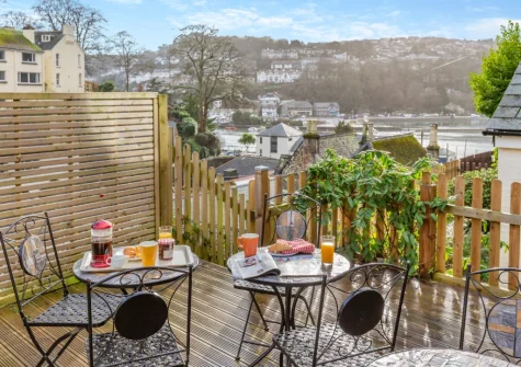 The rear tiered garden with decked terrace & alfresco dining area at Alvaston, Looe