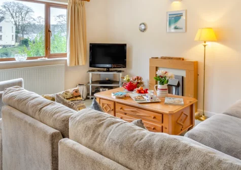 Alvaston, Looe is a charming three-storey hillside retreat boasting glorious river views from almost every room, enclosed tiered gardens perfect for peaceful relaxation, and the harbour town's beaches, restaurants, and South West Coast Path close by.
