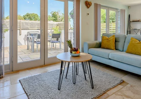 An Skyber, St Breock is a stylish two-bedroom cottage on Wadebridge's peaceful outskirts, featuring contemporary interiors, a wonderful suntrap balcony, and easy access to the golden beaches of Rock and Polzeath just seven miles away.