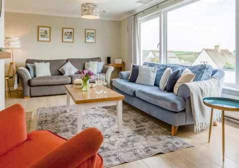 Anchor Watch, Fowey is a stylish three-bedroom house with beautiful river views, a large enclosed garden with terrace, and a prime position in this picturesque harbour town, perfect for families and friends exploring Cornwall's stunning south coast.