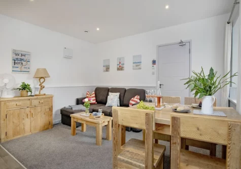 The living & dining area at Anchors Away at Sunnybeach Apartments, Paignton