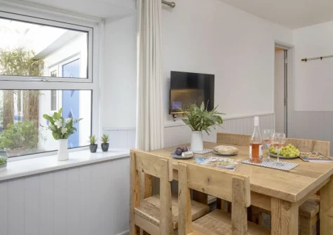 The dining area at Anchors Away at Sunnybeach Apartments, Paignton