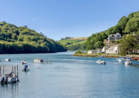 The picturesque Looe estuary extends upstream from the harbour into the valleys of the West and East Looe