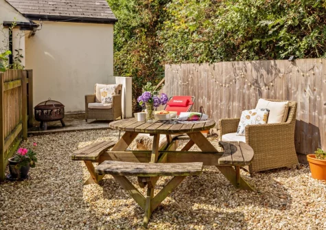 The small enclosed garden, barbecue & alfresco dining area at Annas Cottage, Langtree