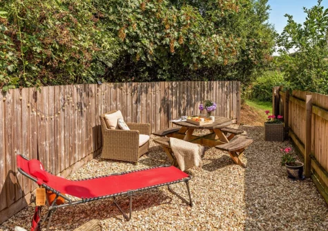 The small enclosed garden, barbecue & alfresco dining area at Annas Cottage, Langtree