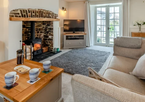 Annie's Cottage, Appledore is a charming three-bedroom fisherman's retreat in the heart of this historic maritime village, featuring a warming wood burner, sunny cobbled courtyard, and with the pretty quayside just moments from your door.