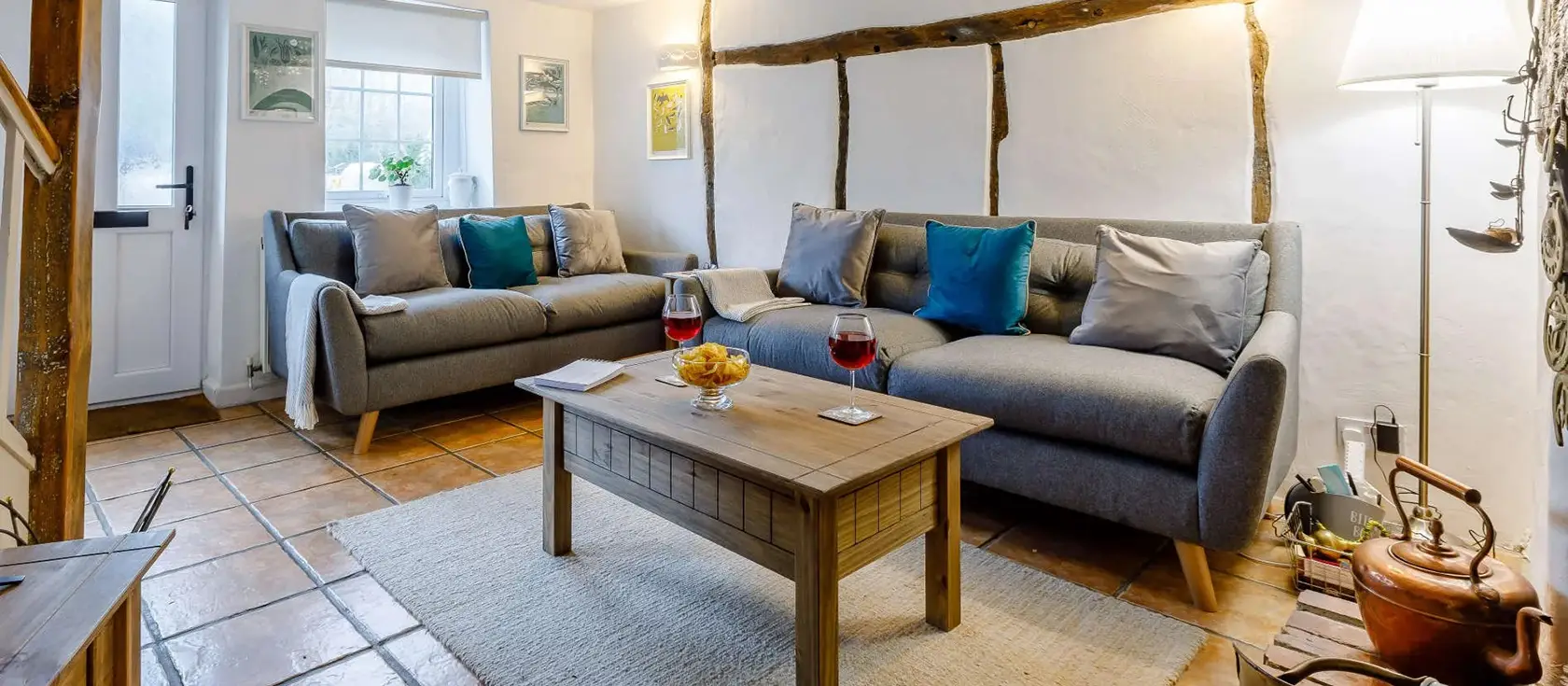 Anvil Cottage, Barnstaple is a charming 200-year-old former blacksmith's cottage retreat featuring original exposed beams, cosy wood burner, and delightful south-facing tiered garden. Perfect for families seeking authentic countryside charm.