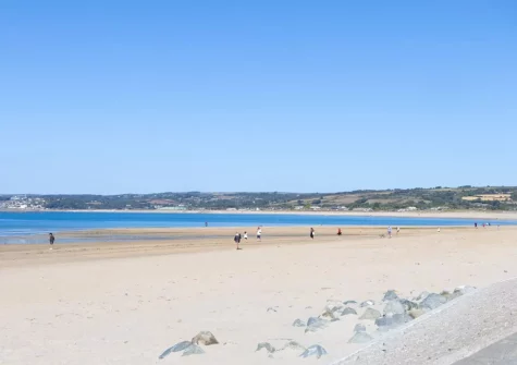 Marazion's beach is wide & sandy with calm water for kayaking, SUPing & swimming