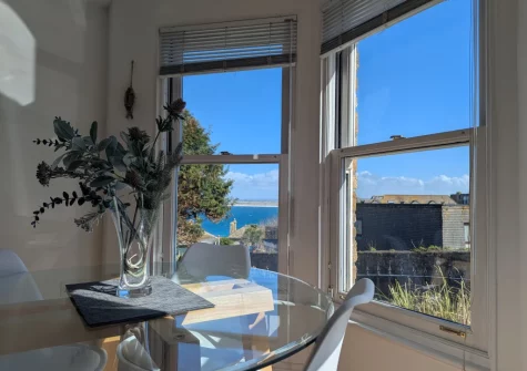 The dining area at Apartment 1,  Oceanis, St Ives