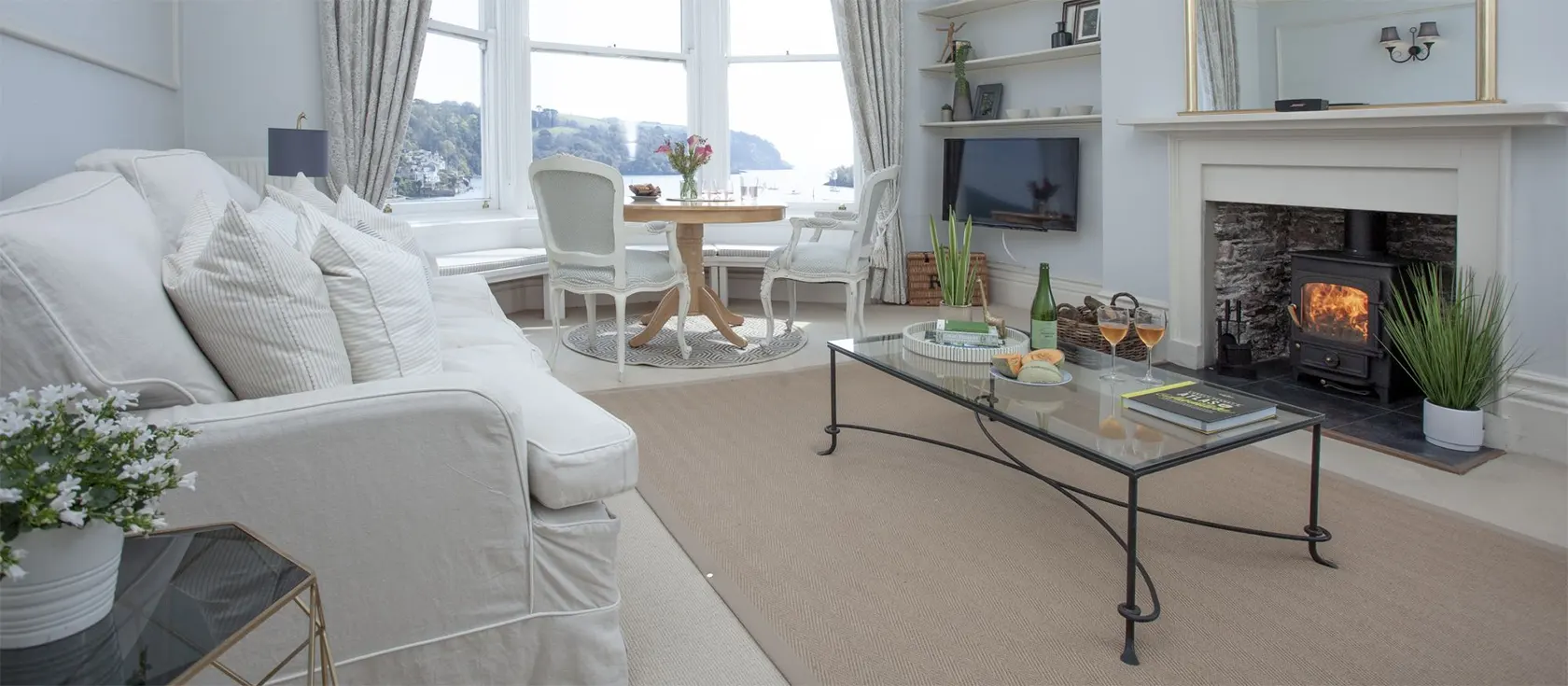 Apartment 3 The Manor House, Dartmouth is a two bedroom, two bathroom apartment in a restored Grade II Georgian property with bay windows overlooking the river. Sitting room with period features & logburner. Modern kitchen. Walk to restaurants, shops & ferry.
