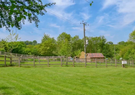 The enclosed lawned garden at Apple Barrel Barn, Dunkeswell Abbey
