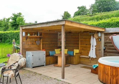 The patio, covered seating area & hot tub, at Apple Blossom at Devon Heaven Hideaways, Kenn