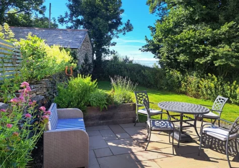 The patio, outdoor sitting area & rear garden at Appleloft, Pencuke