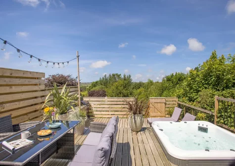 The decked terrace, hot tub & alfresco dining area at Appletree Cottage, Kilkhampton