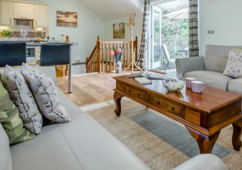 April Cottage at Sanctuary Farm, Woodford is a converted barn retreat set in peaceful North Devon countryside, featuring valley views, an elevated enclosed garden, and direct woodland paths to Duckpool beach, close to Bude and Tintagel.