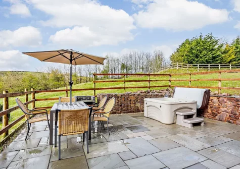 The patio, alfresco dining area & hot tub at Art House, West Ridge Farm, Well Town
