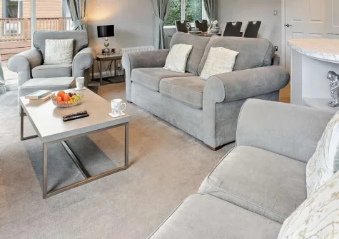 Ash Lodge, Meldon is a beautifully appointed two-bedroom retreat on the edge of Dartmoor National Park, featuring a private hot tub, contemporary open-plan living, and a decked terrace perfect for starlit soaks after days exploring moorland trails.