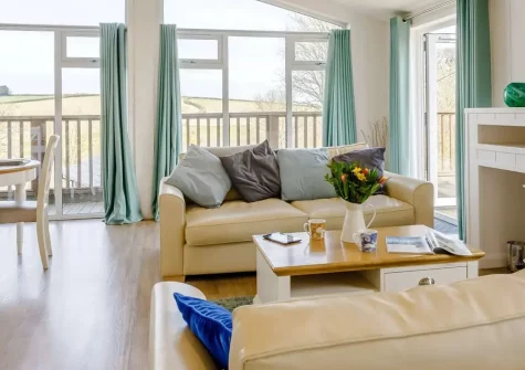 Ash Lodge, The Retreat is a cosy woodland lodge with hot tub, perfect for families seeking rural charm near North Devon's golden beaches. Enjoy countryside views, modern amenities, and peaceful woodland walks for unforgettable memories.