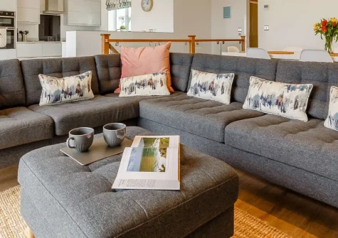 Aspen Beach House, Westward Ho! is a luxurious four-bedroom retreat with panoramic Atlantic views, just 150m from golden sands. Featuring contemporary interiors, a sun-trap garden, & a stunning ocean-facing balcony, it's perfect for family breaks.