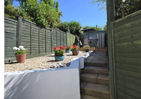 Stairs up to the decked alfresco dining & barbecue area at Aunties Cottage, Appledore