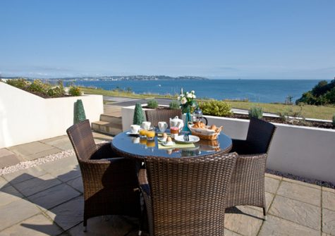 The terrace with outdoor seating @ Avocet 1, The Cove, Brixham
