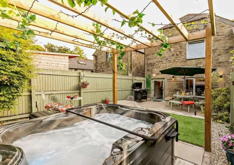 The hot tub, patio  & alfresco dining area at Badgers At Langoose, Lanhydrock