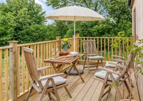 The enclosed decked wrap-around balcony & outdoor sitting area at Bailey Lodge, Barnstaple