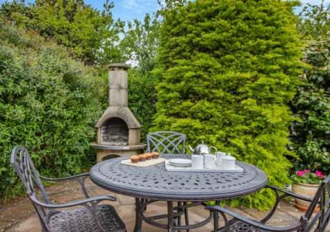The patio, barbecue, alfresco dining area & enclosed garden at Bamboo, Croyde