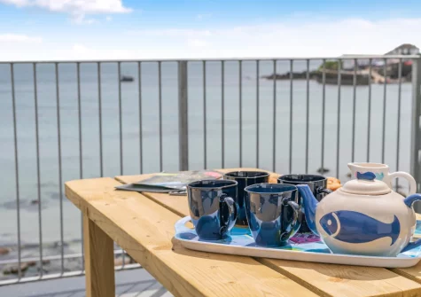 The front balcony & outdoor sitting area at Barachy, Coverack