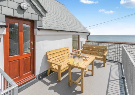The side balcony & outdoor sitting area at Barachy, Coverack