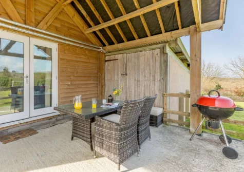 The enclosed patio, barbecue & alfresco dining area at Barley Mow Cottage, North Nethercleave Farm, Umberleigh