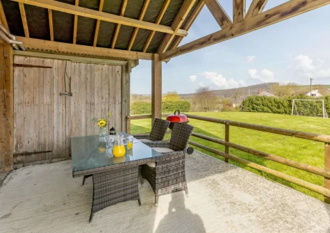 The enclosed patio, barbecue & alfresco dining area at Barley Mow Cottage, North Nethercleave Farm, Umberleigh