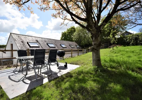The patio, barbecue, alfresco dining area & enclosed garden at Barn at East Hele, Kings Nympton