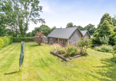 The large garden at Barn at Little Greenslade, Sampford Courteney