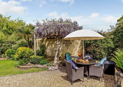 The garden & alfresco dining area at Barn Cottage, Brixham