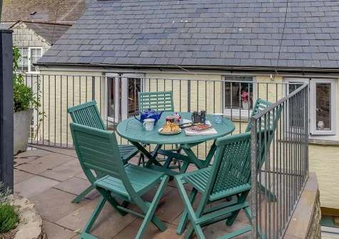 The patio & alfresco dining area at Barney Cottage, Polruan